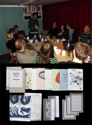 Roland in the kitchen with members and guests and his pamphlet series.